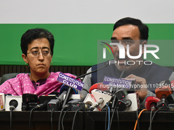 Aam Aadmi Party (AAP) leaders, Atishi Marlena (L) and Gopal Rai (R), along with members of INDIA (Indian National Development Inclusive Alli...
