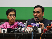 Aam Aadmi Party (AAP) leaders, Atishi Marlena (L) and Gopal Rai (R), along with members of INDIA (Indian National Development Inclusive Alli...