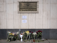 People are placing flowers outside the Russian embassy in Tehran, Iran, on March 24, 2024, to honor the victims of a shooting at the Crocus...