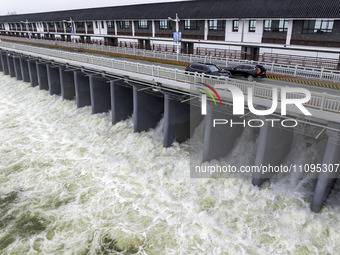 An aerial photo is showing the flood discharge from the 63-hole sluice of the Sanhe Gate of Hongze Lake in Huai'an, China, on March 24, 2024...