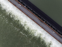 An aerial photo is showing the flood discharge from the 63-hole sluice of the Sanhe Gate of Hongze Lake in Huai'an, China, on March 24, 2024...