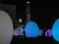 People are viewing ''Continuous'' by teamLab in Tamar Park, Hong Kong, China, on March 24, 2024. (