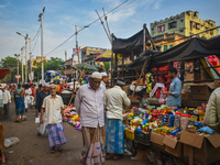 People are buying their daily needs at a marketplace during the fasting month of Ramadan in Kolkata, India, on March 24, 2024. (