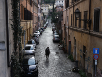 A man walks a street in Rome, Italy on March 24, 2024. (