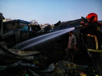 A fire is breaking out in a slum on T&T Boys School Road in Mohakhali, Dhaka, around 4:15. (