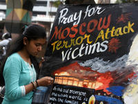 Students from Gurukul are painting posters as a tribute to the victims of the recent Moscow terror attack in Mumbai, India, on March 23, 202...
