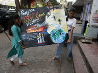 Students from Gurukul are painting posters as a tribute to the victims of the recent Moscow terror attack in Mumbai, India, on March 23, 202...