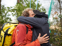 Reva, one of the three 'Ecureuils', is being hugged by a friend. After 37 days in the trees, the last three 'Ecureuils' living in the ZAD (Z...