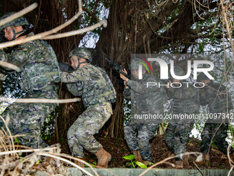 Armed police officers are conducting a mountain forest tactics training in Beihai, China, on March 25, 2024. (