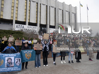 Demonstrators are holding placards outside the Ukrainian House National Centre in support of Ukrainian prisoners of war and the missing duri...
