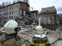 Ukrainian rescuers are working at the site of a building damaged by a Russian rocket attack in Kyiv, Ukraine, on March 25, 2024, amid Russia...