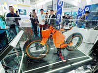Visitors are viewing the ''Hydrogen Hybrid Wheeled Robot Vehicle'' at the 2024 Beijing International Hydrogen Technology and Equipment Exhib...