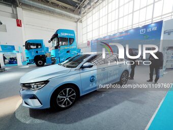 Visitors are viewing a ''hybrid car'' at the 2024 Beijing International Hydrogen Energy Technology and Equipment Exhibition at the China Int...