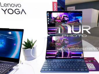 Lenovo is exhibiting the Yoga Book 9i, a laptop with dual OLED touchscreens, at the Mobile World Congress 2024 in Barcelona, Spain, on March...