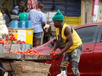 A tomato seller is awaiting buyers as many raw food vendors are recording low sales during the Ramadan period in Ogba, Lagos, Nigeria, on Ma...