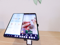 The OnePlus Open, a vertically folding smartphone designed by the Chinese company and subsidiary of Oppo, is displaying TikTok videos on And...