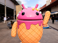The Google Android logo and mascot, known as Bugdroid by the community, is being displayed as a statue resembling a strawberry ice-cream con...