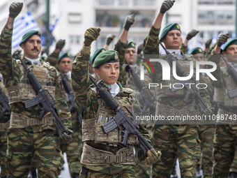 A female officer is marching in the military parade. (