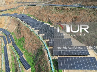 A photovoltaic power generation facility at an abandoned mine is being seen from the air in Hangzhou, Zhejiang Province, China, on March 26,...