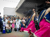 People watch Desi Moves and Vibes perform at a celebration of Holi, the Hindu holiday marking love and spring, in Washington, DC, March 25,...