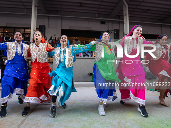 DC Bhangra Crew performs at a celebration of Holi, the Hindu holiday marking love and spring, in Washington, DC, March 25, 2024.   The holid...