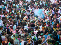 People celebrate Holi, the Hindu holiday marking love and spring, in Washington, DC, March 25, 2024.   The holiday, often known as the Festi...