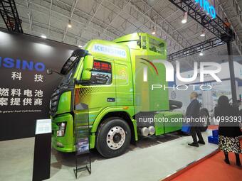 Visitors are viewing the ''Hydrogen Energy Heavy Truck'' at the 2024 China International Hydrogen Energy and Fuel Cell Industry Exhibition a...