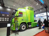 Visitors are viewing the ''Hydrogen Energy Heavy Truck'' at the 2024 China International Hydrogen Energy and Fuel Cell Industry Exhibition a...