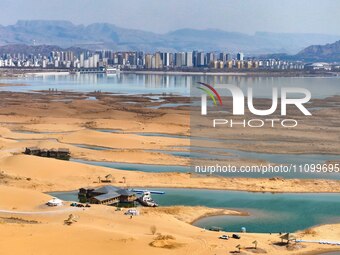 An aerial photo is showing the scenery of Wuhai Lake in Wuhai City, Inner Mongolia Autonomous Region, North China, on March 26, 2024. (