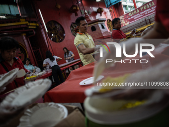 Indonesian Buddhists are preparing iftar meals during the Muslim holy month of Ramadan at a temple in Jakarta, Indonesia, on March 26, 2024....