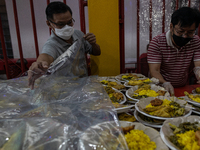 Indonesian Buddhists are preparing iftar meals during the Muslim holy month of Ramadan at a temple in Jakarta, Indonesia, on March 26, 2024....