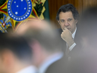Brazil's Finance Minister Fernando Haddad is participating with President Luiz Inacio Lula da Silva in a ceremony at the Planalto Palace in...