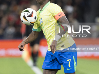Vinicius Junior of Brazil is controlling the ball during the friendly match between Spain and Brazil at Santiago Bernabeu Stadium in Madrid,...