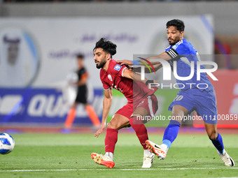 Yousef Al Sulaiman (R) of Kuwait is in action against Tarek Salman of Qatar during the FIFA World Cup 2026 and the AFC Asian Cup Saudi Arabi...