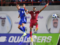 Salman Bormeya of Kuwait is in action against TIsmaeel Mohammad of Qatar during the FIFA World Cup 2026 and the AFC Asian Cup Saudi Arabia 2...