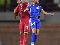 Yousef Al Sulaiman (R) of Kuwait is in action against Almahdi Ali of Qatar during the FIFA World Cup 2026 and the AFC Asian Cup Saudi Arabia...