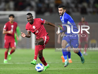 Redha Hani (R) of Kuwait is in action against Almoez Ali of Qatar during the FIFA World Cup 2026 and the AFC Asian Cup Saudi Arabia 2027 Qua...