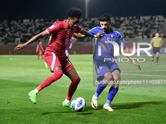 Redha Hani (R) of Kuwait is in action against Yusuf Abdurisag of Qatar during the FIFA World Cup 2026 and the AFC Asian Cup Saudi Arabia 202...