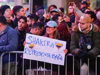 Fans are watching Colombian singer-songwriter Shakira, who is performing in New York, on March 26, 2024, at the southeast corner of Broadway...