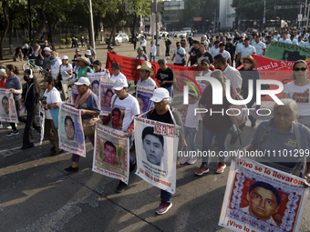 Relatives of the Ayotzinapa victims are taking part in a demonstration to demand justice for the disappearance of the 43 students from the r...
