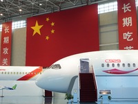 A prototype of the C929 passenger jet is being displayed at the COMAC Shanghai Aircraft Design and Research Institute in Shanghai, China, on...