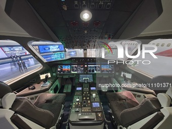 The cockpit of a C929 passenger jet is being seen at the COMAC Shanghai Aircraft Design and Research Institute in Shanghai, China, on March...