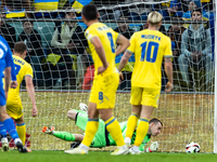Andriy Lunin is passing the ball during the UEFA EURO 2024 Play-Offs final match between Ukraine and Iceland in Wroclaw, Poland, on March 26...