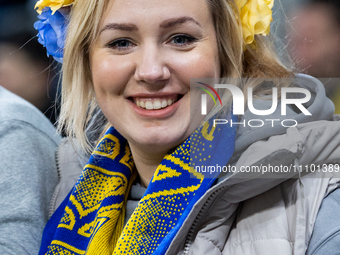 A Ukrainian fan is smiling for the camera before the UEFA EURO 2024 Play-Offs final match between Ukraine and Iceland in Wroclaw, Poland, on...