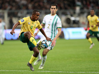 Aissa Mandi (R) of Algeria is in action with Iqraam Rayners of South Africa during the international friendly match in Algiers, Algeria, on...