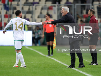 Houssem Aouar (left) is with Algerian coach Vladimir Petkovic (right) during the international friendly match in Algiers, Algeria, on March...