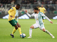 Houssem Eddine Aouar (R) of Algeria is in action with Elias Sepho Mokwana of South Africa during the international friendly match in Algiers...
