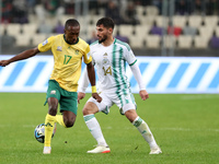 Houssem Eddine Aouar (R) of Algeria is in action with Elias Sepho Mokwana of South Africa during the international friendly match in Algiers...