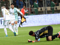 Yassine Benzia (L) is reacting after scoring a goal during the international friendly match between Algeria and South Africa in Algiers, Alg...