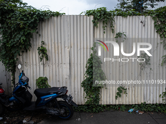 Fences around an unmaintained building are being seen in the business district during the holy month of Ramadan in Jakarta, Indonesia, on Ma...
